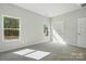 Well-lit bedroom with carpeting and a view from the large window at 844 Westminster Dr, Statesville, NC 28677
