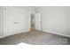 This bedroom has an off-white color scheme with natural light and carpet at 844 Westminster Dr, Statesville, NC 28677