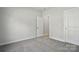 Clean bedroom featuring carpet, neutral walls, and bright white trim at 844 Westminster Dr, Statesville, NC 28677