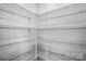 White wire shelving in the closet for storage at 844 Westminster Dr, Statesville, NC 28677