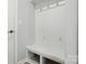 Entryway with beadboard accents, hooks, and built-in bench with storage at 844 Westminster Dr, Statesville, NC 28677