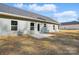 Back of house featuring modern vinyl siding and a concrete patio at 844 Westminster Dr, Statesville, NC 28677