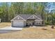 Charming single Gathering home featuring a two-car garage, neutral siding, and a well-maintained yard at 844 Westminster Dr, Statesville, NC 28677