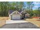 Charming single Gathering home featuring a two-car garage, neutral siding, and a well-maintained yard at 844 Westminster Dr, Statesville, NC 28677