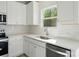 Bright kitchen featuring stainless steel appliances, white countertops, and natural light at 844 Westminster Dr, Statesville, NC 28677