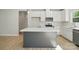 Kitchen with island, stainless steel appliances, wood flooring, and pendant lighting at 844 Westminster Dr, Statesville, NC 28677