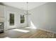 Living room area with door to outside and lots of natural light at 844 Westminster Dr, Statesville, NC 28677