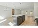 Open-concept living space showcasing an island, recessed lights, and wood-look flooring at 844 Westminster Dr, Statesville, NC 28677
