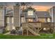 Charming backyard featuring a wooden deck with stairs and hot tub, perfect for outdoor relaxation at 8904 Saint Pierre Ln, Charlotte, NC 28277
