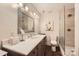 Bright bathroom featuring a marble countertop, modern fixtures, and glass shower at 8904 Saint Pierre Ln, Charlotte, NC 28277