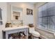 Bathroom with glass bowl sink, a marble countertop, toilet, and natural lighting at 8904 Saint Pierre Ln, Charlotte, NC 28277