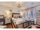 Bedroom featuring a chandelier, a large bed, and hardwood floors at 8904 Saint Pierre Ln, Charlotte, NC 28277