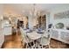 Charming dining room featuring hardwood floors, a stylish chandelier, and a decorative cabinet at 8904 Saint Pierre Ln, Charlotte, NC 28277