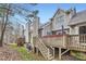 Charming home's exterior featuring a wooden deck with hot tub, perfect for relaxation and outdoor enjoyment at 8904 Saint Pierre Ln, Charlotte, NC 28277