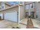Home exterior showcases a two-car garage, front door, and manicured landscaping at 8904 Saint Pierre Ln, Charlotte, NC 28277