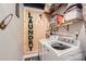 Bright laundry room with modern washer and dryer and rustic decor at 8904 Saint Pierre Ln, Charlotte, NC 28277