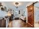 Spacious office with a decorative ceiling, arched window, barn door, and hardwood floors at 8904 Saint Pierre Ln, Charlotte, NC 28277