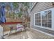 Charming back patio with table and chairs, perfect for relaxing and enjoying the outdoors at 8904 Saint Pierre Ln, Charlotte, NC 28277