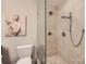 Modern tiled shower featuring glass surround, with multiple shower heads at 8904 Saint Pierre Ln, Charlotte, NC 28277