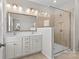 Bathroom featuring double sinks, granite counters, and glass-enclosed shower at 9108 Ainslie Downs St, Charlotte, NC 28273