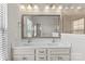 Bathroom with double sinks and large mirror, modern fixtures and lighting at 9108 Ainslie Downs St, Charlotte, NC 28273