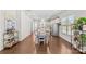 Open-concept dining area with wood floors is adjacent to the kitchen and includes a stylish bar cart at 9108 Ainslie Downs St, Charlotte, NC 28273
