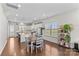 Bright dining area features an open floor plan with wood floors and direct access to the kitchen at 9108 Ainslie Downs St, Charlotte, NC 28273