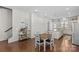 The light-filled dining area features wood floors and is conveniently located near the kitchen and staircase at 9108 Ainslie Downs St, Charlotte, NC 28273