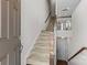 View of the entryway with a staircase and a glimpse into the adjacent living area at 9108 Ainslie Downs St, Charlotte, NC 28273