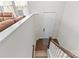 View from stairs leading to the front door and entryway with hardwood flooring and neutral walls at 9108 Ainslie Downs St, Charlotte, NC 28273