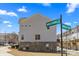 Exterior side view of townhouse with street signs at 9108 Ainslie Downs St, Charlotte, NC 28273