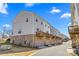 View of townhouse exteriors with garages and wooden balconies at 9108 Ainslie Downs St, Charlotte, NC 28273