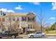 Charming townhome showcasing stone accents, a neutral palette, and a welcoming front entrance at 9108 Ainslie Downs St, Charlotte, NC 28273