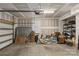 View of a garage with cement floor and shelving unit at 9108 Ainslie Downs St, Charlotte, NC 28273