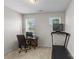 Bright office space with a computer, desk, treadmill and natural light; ideal for working from home at 9108 Ainslie Downs St, Charlotte, NC 28273