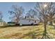 Back exterior view of home showing lawn and air conditioning unit at 966 Marys Grove Rd, Cherryville, NC 28021