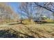 Landscaped lawn with mature trees on a sunny day at 966 Marys Grove Rd, Cherryville, NC 28021
