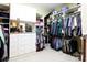 Large walk-in closet with custom shelving, drawers, and ample storage space for clothes at 1038 Rolling Park Ln, Fort Mill, SC 29715
