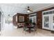 Charming brick patio with a ceiling fan, dining set, and comfortable seating, perfect for outdoor entertaining at 1038 Rolling Park Ln, Fort Mill, SC 29715