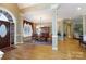 Spacious dining room with hardwood floors, elegant furnishings, and natural light at 1038 Rolling Park Ln, Fort Mill, SC 29715