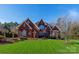 Inviting two-story brick home with manicured lawn and tasteful landscaping at 1038 Rolling Park Ln, Fort Mill, SC 29715