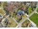 Stunning aerial view of a home surrounded by lush greenery and a well-manicured lawn in a desirable neighborhood at 105 Elizabeth Brook Dr, Davidson, NC 28036