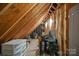 Attic with exposed rafters and storage at 105 Elizabeth Brook Dr, Davidson, NC 28036