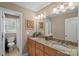 Bathroom featuring double vanity and granite counters at 105 Elizabeth Brook Dr, Davidson, NC 28036