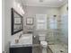 Modern bathroom features a glass shower, gray walls, and an eye-catching vanity at 105 Elizabeth Brook Dr, Davidson, NC 28036