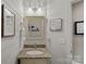 Charming powder room featuring shiplap accent wall, granite vanity, and updated fixtures at 105 Elizabeth Brook Dr, Davidson, NC 28036
