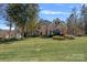 Well-manicured front yard of a beautiful home with brick and siding, showcasing curb appeal at 105 Elizabeth Brook Dr, Davidson, NC 28036