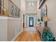 Bright foyer with high ceilings, chandelier, hardwood floors, and elegant staircase at 105 Elizabeth Brook Dr, Davidson, NC 28036