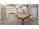This game room features a billiards table and wrought iron railing at 105 Elizabeth Brook Dr, Davidson, NC 28036