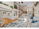Open floor plan showcasing the seamless connection between the living room, kitchen, and staircase at 105 Elizabeth Brook Dr, Davidson, NC 28036